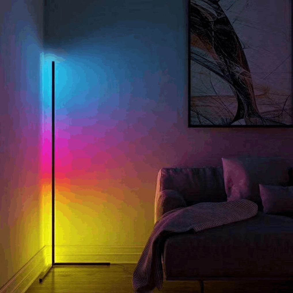 RGB floor lamp casting soft color mood for bedroom or gaming setup decor.