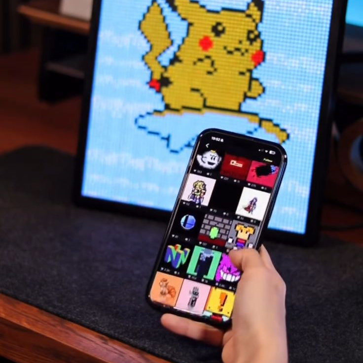 Person using there phone to seamlessly add characters to their animated pixel display