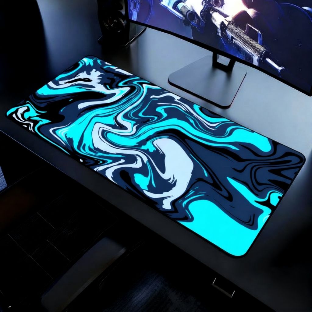 Blue, black and white swirl design gaming Mousepad seen on a gaming desk