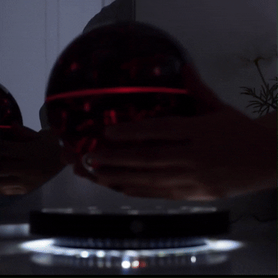 Floating moon lamp rotating mid-air with soft LED lighting, ideal for cozy room or futuristic home interior.