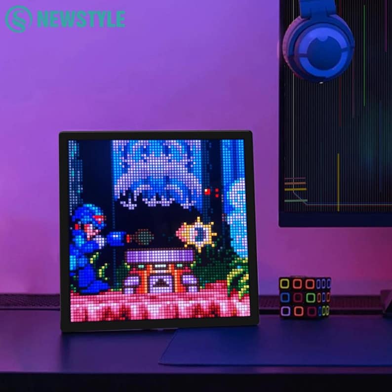 LED pixel art display showing Mega Man animation in a retro gaming desk setup