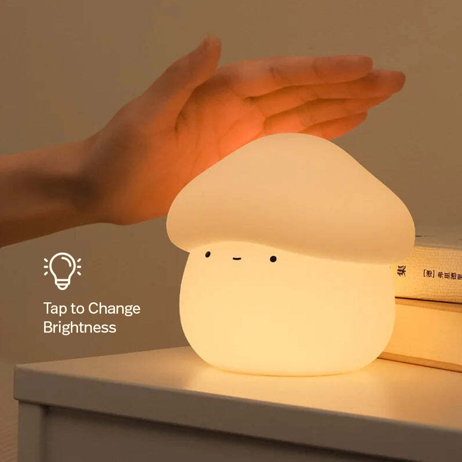 Hand adjusting mushroom lamp brightness for cozy bedroom lighting and aesthetic room setup.