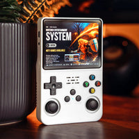 White retro handheld game console near books, minimalist gaming setup