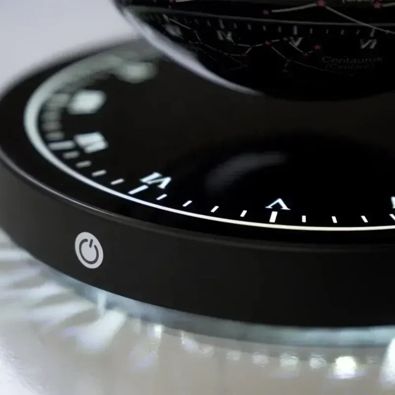 Close-up of magnetic clock base showing levitation detail of 3D printed moon lamp for futuristic home interiors.