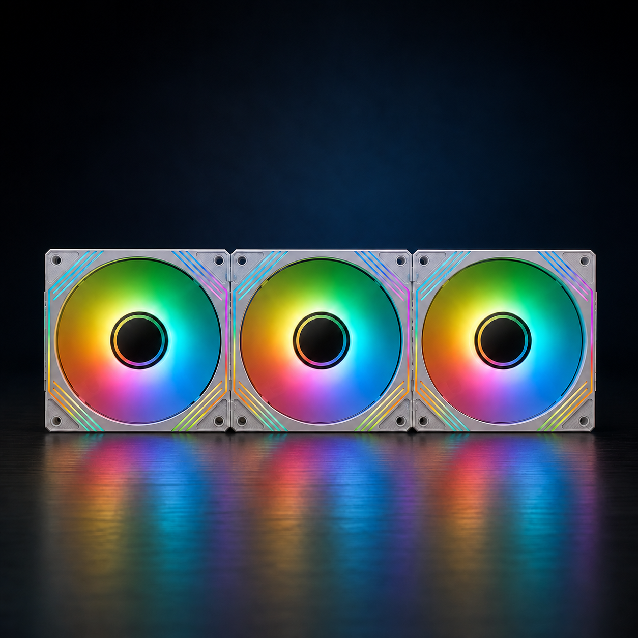 Three white 140mm ARGB case fans lined up on a dark desk