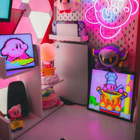 Colorful room setup with neon signs, video games, and plush toys.