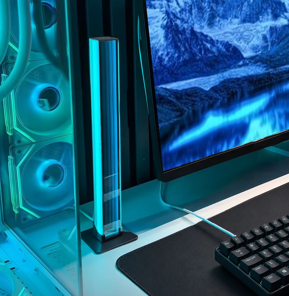Gaming light bars beside a monitor in a blue illuminated desk setup.