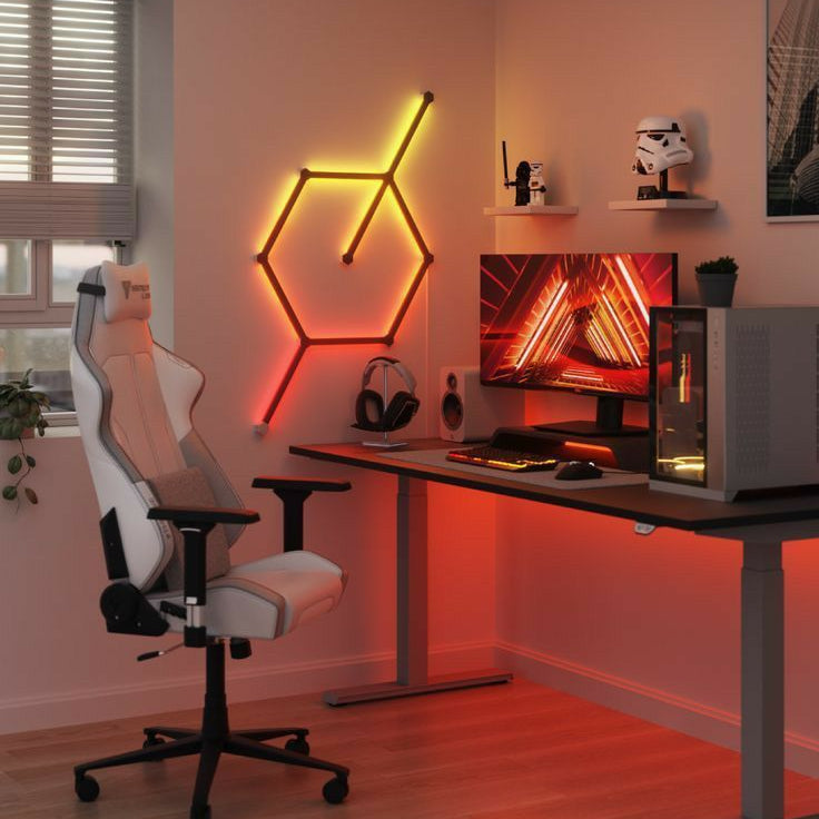 Gaming room setup featuring RGB smart wall lamp with vivid colors