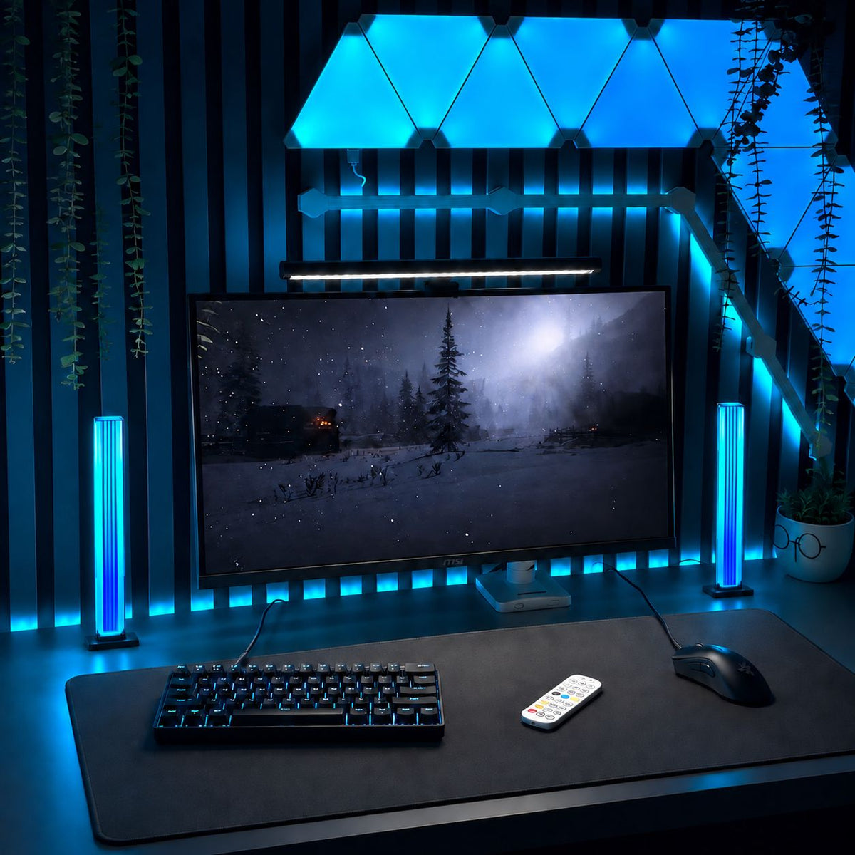 RGB gaming setup lights illuminating a desktop gaming area with monitor and wall panels.