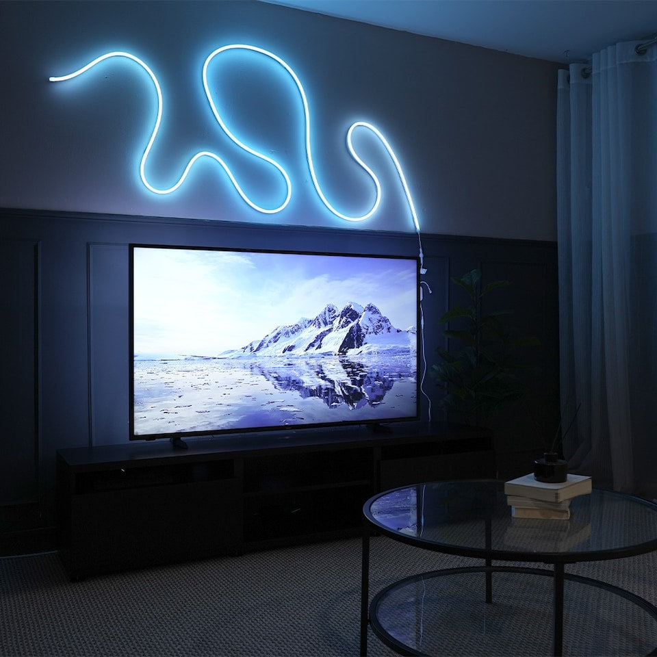 Neon rope light adding accent lighting to a gaming room, with flexible shaping and smooth RGB colour for a custom wall display.