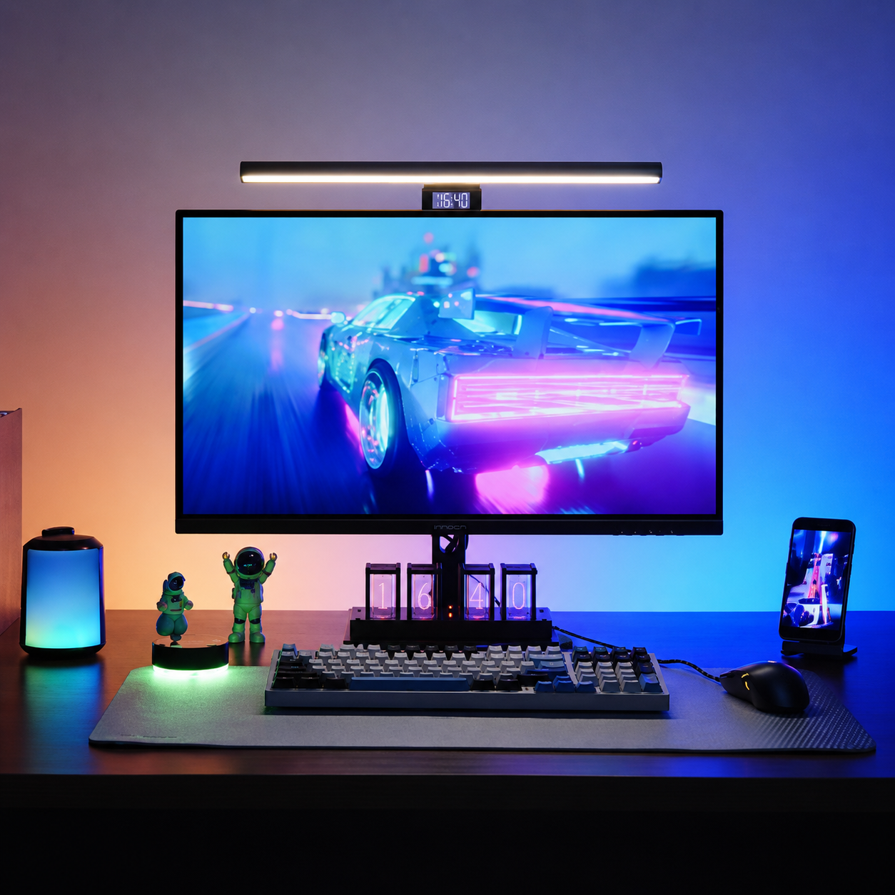 RGB monitor light bar installed above a desktop screen with focused desk lighting and ambient RGB backlighting