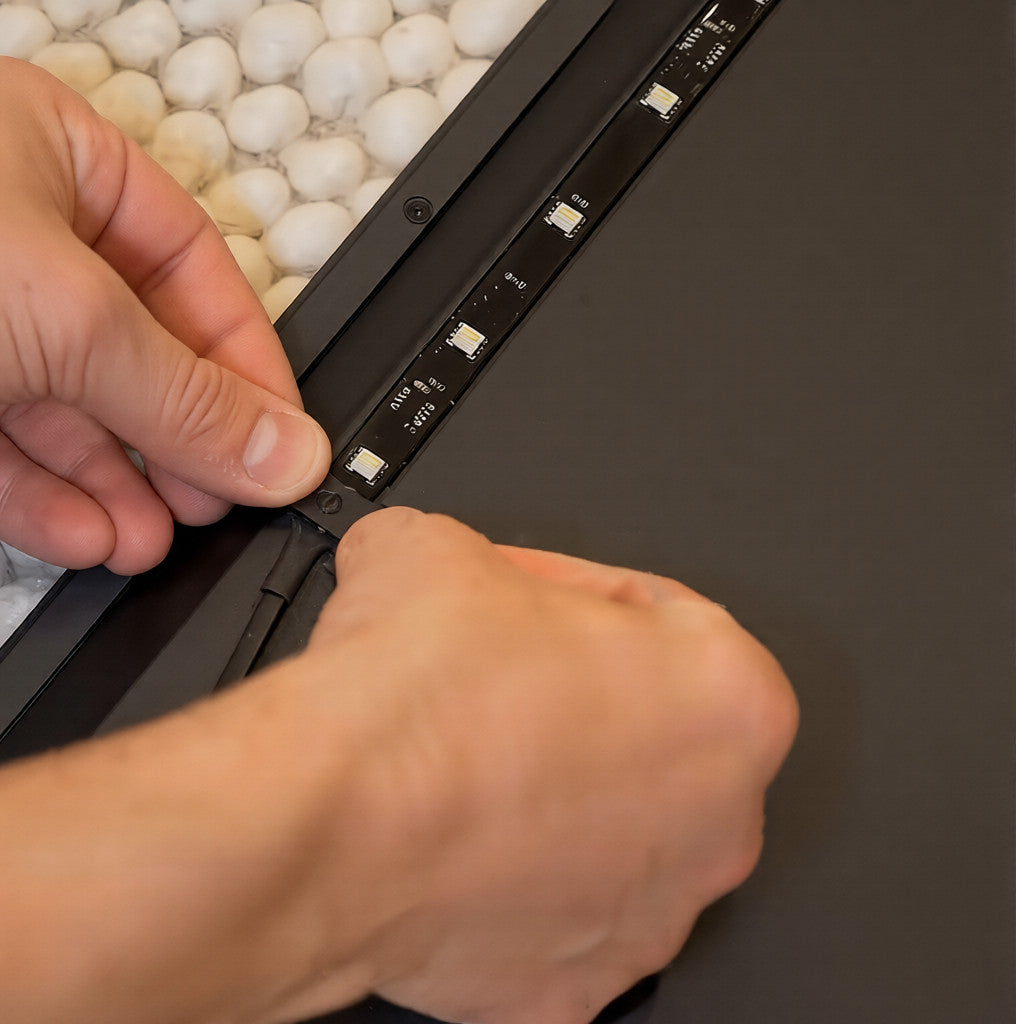 RGBIC strip lights for tv installed on the back of a television during quick setup