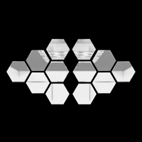 silver acrylic wall mirrors arranged neatly on dark textured wall for reflective modern decor