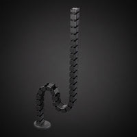 Single flexible cable management tube standing upright for clean desk cable routing