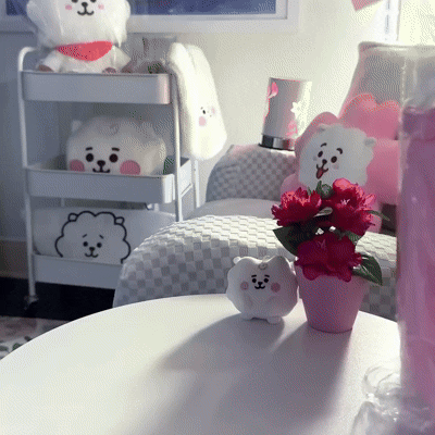 Animated GIF showing a soft boba tea plush toy being squeezed, highlighting cozy texture