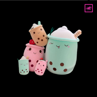 A group of colorful boba tea plush toys sitting on a table, part of Zyko’s Everyday Comforts Collection